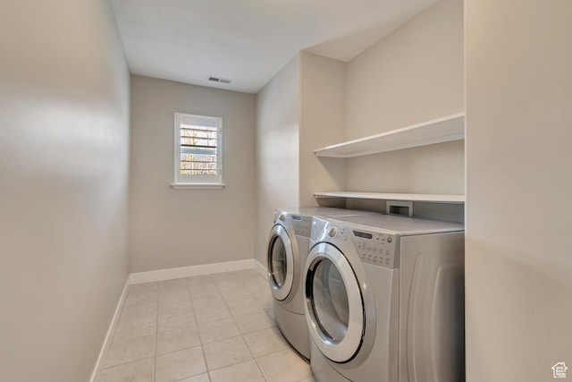 11968 N Ithica Dr, Highland, UT 84003 - laundry area featuring laundry area, light tile patterned floors, visible vents, baseboards, and washer and clothes dryer