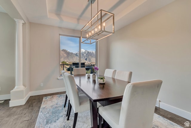 11968 N Ithica Dr, Highland, UT 84003 - dining space featuring a mountain view, decorative columns, and baseboards
