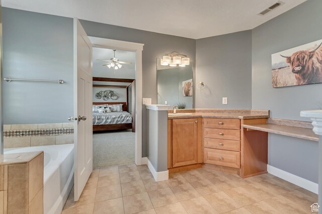 11968 N Ithica Dr, Highland, UT 84003 - full bathroom with visible vents, a ceiling fan, ensuite bath, vanity, and tile patterned flooring