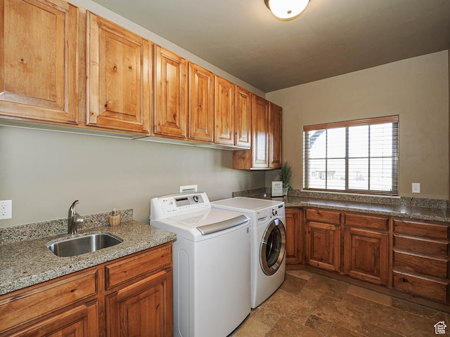 220 S 1970 E, Heber City, UT 84032 - washroom with stone finish flooring, a sink, cabinet space, and washer and clothes dryer