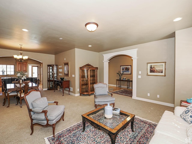 220 S 1970 E, Heber City, UT 84032 - living area with baseboards, a chandelier, recessed lighting, arched walkways, and light colored carpet