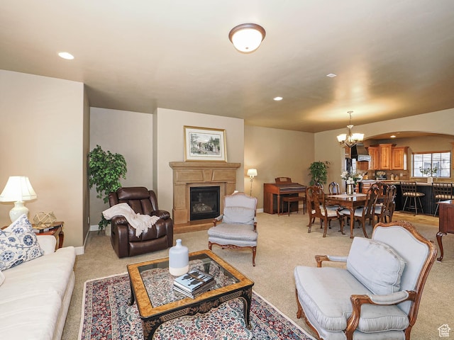 220 S 1970 E, Heber City, UT 84032 - living area featuring baseboards, a notable chandelier, recessed lighting, a glass covered fireplace, and light carpet