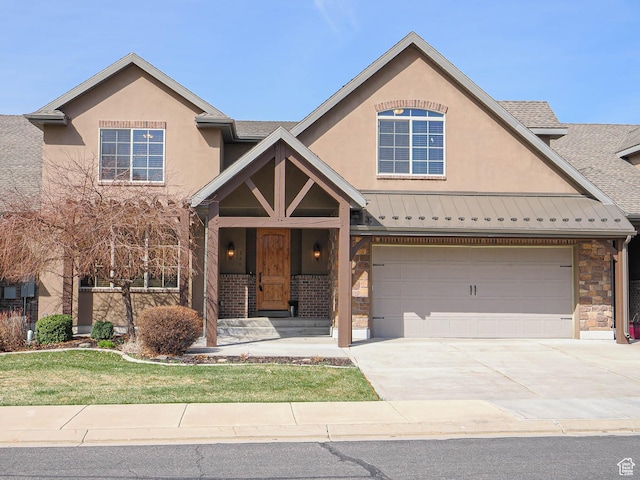 220 S 1970 E, Heber City, UT 84032 - view of front facade featuring stucco siding, driveway, stone siding, a standing seam roof, and metal roof