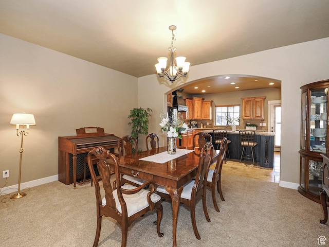 220 S 1970 E, Heber City, UT 84032 - dining area featuring an inviting chandelier, arched walkways, recessed lighting, light carpet, and baseboards