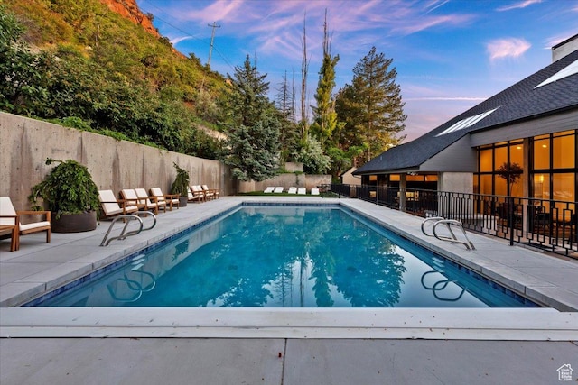 1449 S Devonshire Dr, Salt Lake City, UT 84108 - view of swimming pool featuring a patio, a fenced backyard, and a fenced in pool