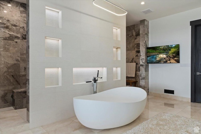 1449 S Devonshire Dr, Salt Lake City, UT 84108 - bathroom featuring a freestanding tub, marble finish floor, visible vents, and walk in shower
