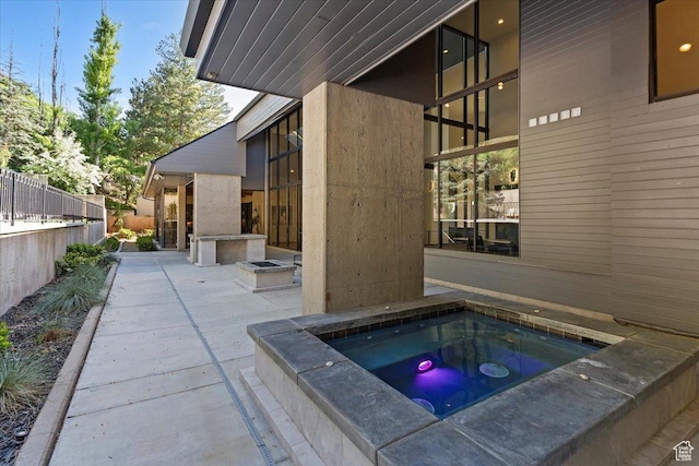 1449 S Devonshire Dr, Salt Lake City, UT 84108 - view of pool with a patio area, fence, and an in ground hot tub