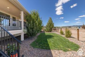 8836 W 3200 S, Cedar City, UT 84720 - view of yard featuring fence