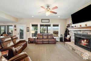 8836 W 3200 S, Cedar City, UT 84720 - living room featuring recessed lighting, a fireplace, and a ceiling fan