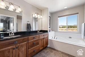 8836 W 3200 S, Cedar City, UT 84720 - full bathroom with double vanity, a garden tub, and a sink