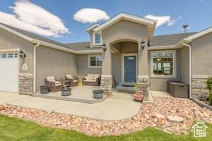 8836 W 3200 S, Cedar City, UT 84720 - rear view of house featuring a patio, a garage, stucco siding, and stone siding