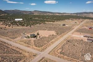 8836 W 3200 S, Cedar City, UT 84720 - drone / aerial view featuring a rural view, a mountain view, and a desert view