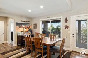 8836 W 3200 S, Cedar City, UT 84720 - dining space with arched walkways, wood finished floors, baseboards, and recessed lighting