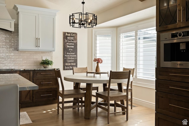 1178 W 13040 S, Riverton, UT 84065 - dining room featuring a chandelier and light wood-style floors