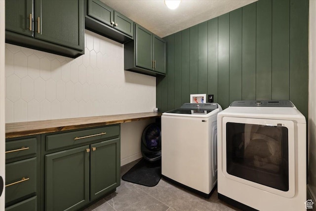 1178 W 13040 S, Riverton, UT 84065 - laundry room with washer and dryer, cabinet space, and light tile patterned flooring
