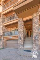 565 S Vasels Rd E Unit 6G, Brian Head, UT 84719 - exterior space featuring stone siding and a balcony