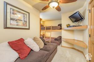 565 S Vasels Rd E Unit 6G, Brian Head, UT 84719 - living room featuring carpet flooring and ceiling fan