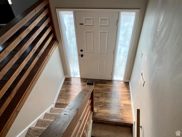 foyer featuring wood finished floors