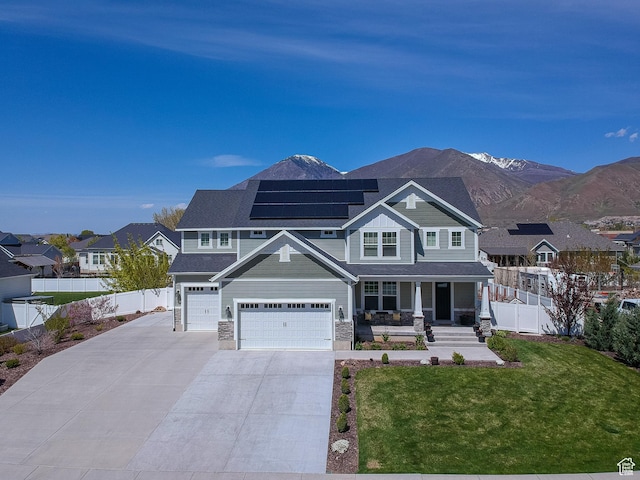 81 E 600 N, Mapleton, UT 84664 - craftsman-style home with solar panels, a porch, fence, an attached garage, and a front yard