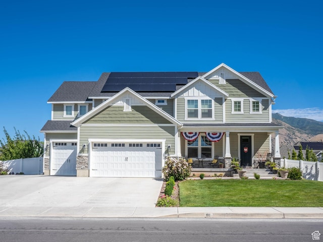 81 E 600 N, Mapleton, UT 84664 - craftsman-style house featuring driveway, covered porch, fence, a front yard, and solar panels