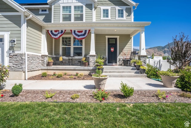 81 E 600 N, Mapleton, UT 84664 - entrance to property featuring a porch, fence, stone siding, and a mountain view