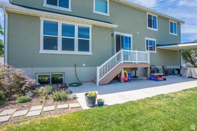 81 E 600 N, Mapleton, UT 84664 - rear view of house with a patio and stucco siding