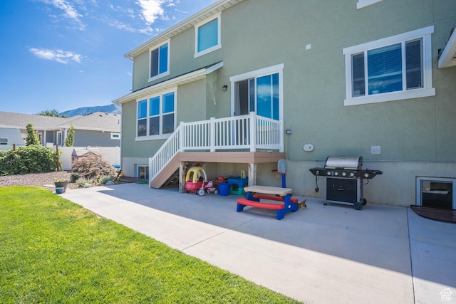 81 E 600 N, Mapleton, UT 84664 - back of house with a lawn, a patio, and stucco siding