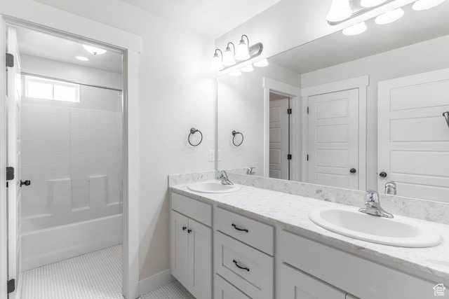 81 E 600 N, Mapleton, UT 84664 - bathroom featuring baseboards, a sink, double vanity, and shower / bathing tub combination