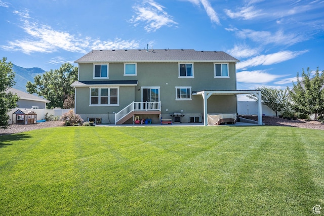 81 E 600 N, Mapleton, UT 84664 - rear view of house featuring a yard, a patio, stucco siding, and fence