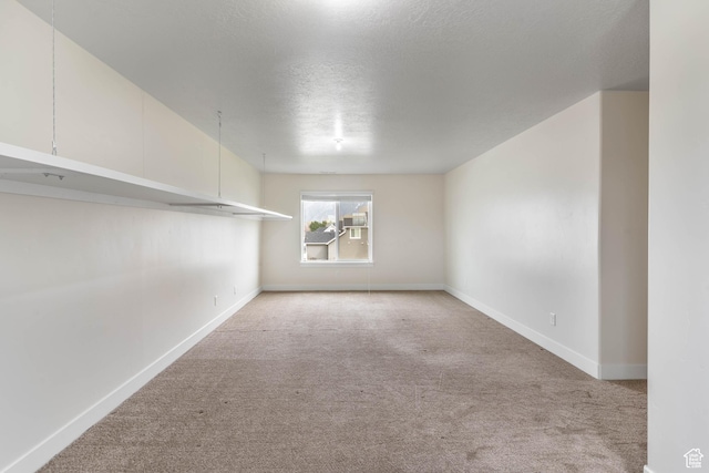 81 E 600 N, Mapleton, UT 84664 - empty room featuring a textured ceiling, carpet flooring, and baseboards