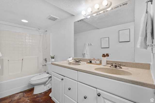 bathroom featuring double vanity, a sink, visible vents, and toilet