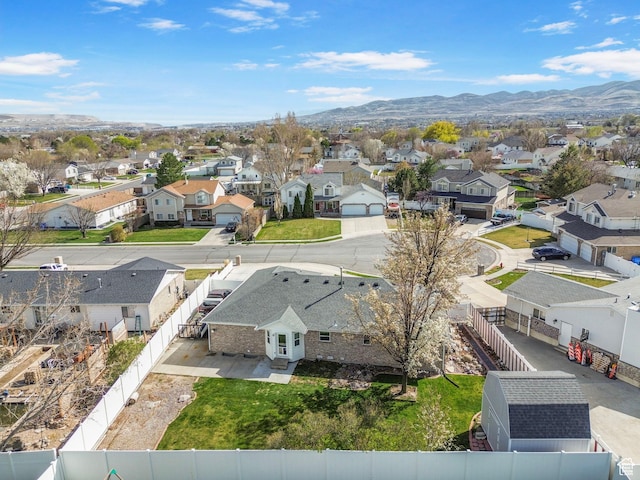 drone / aerial view featuring a residential view and a mountain view
