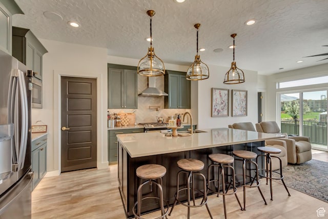 419 W 850 N, Farmington, UT 84025 - kitchen featuring tasteful backsplash, stainless steel fridge, wall chimney exhaust hood, a sink, and open floor plan