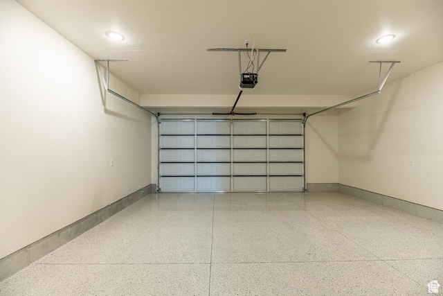 4342 W 5430 S Unit B, Roy, UT 84067 - garage with a garage door opener, baseboards, and recessed lighting