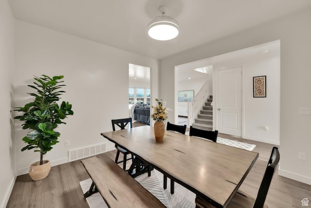 977 S 1480 W, Provo, UT 84601 - dining space featuring visible vents, light wood-style flooring, stairway, and baseboards