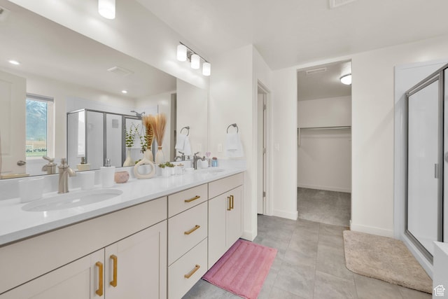 977 S 1480 W, Provo, UT 84601 - full bathroom featuring a spacious closet, double vanity, a sink, and a stall shower