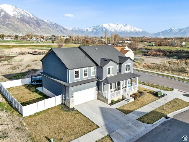 977 S 1480 W, Provo, UT 84601 - view of front of home with a mountain view, driveway, a porch, a garage, and fence