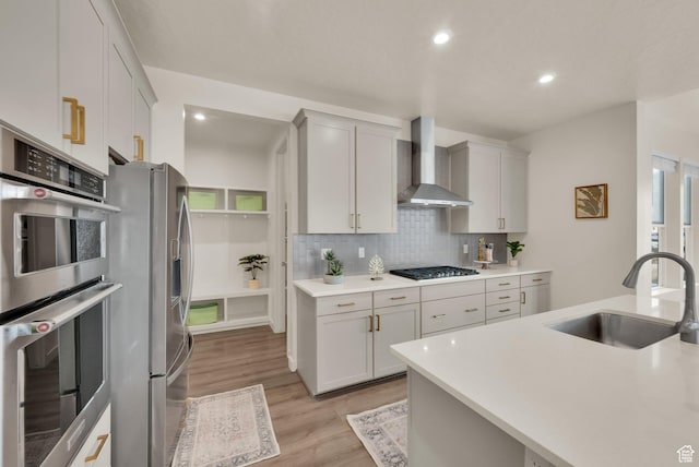 977 S 1480 W, Provo, UT 84601 - kitchen featuring wall chimney exhaust hood, a sink, light countertops, stainless steel appliances, and decorative backsplash