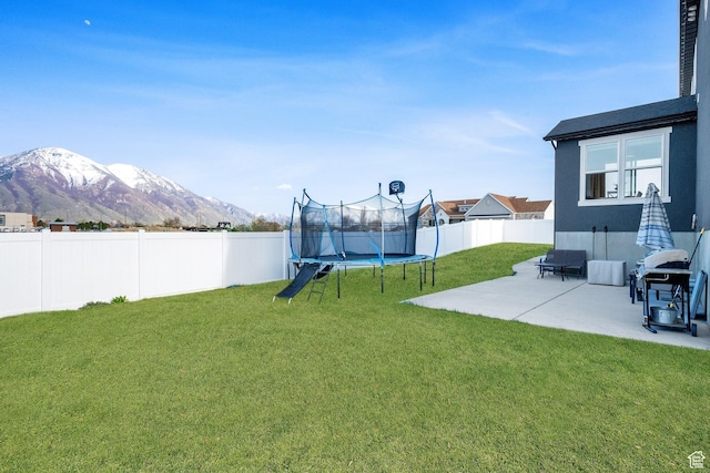 977 S 1480 W, Provo, UT 84601 - view of yard with a trampoline, a patio area, a fenced backyard, and a mountain view