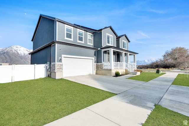 977 S 1480 W, Provo, UT 84601 - view of front facade featuring a front lawn, an attached garage, covered porch, and driveway
