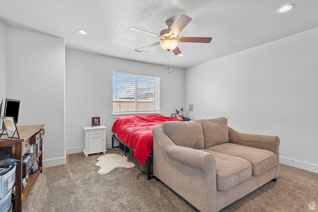 carpeted bedroom featuring visible vents, baseboards, a ceiling fan, a textured ceiling, and recessed lighting