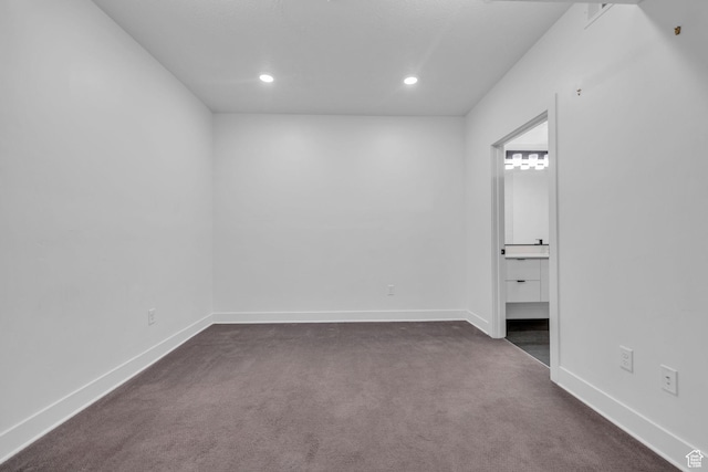 933 S Washington St Unit 107, Salt Lake City, UT 84101 - empty room with baseboards, recessed lighting, and dark colored carpet