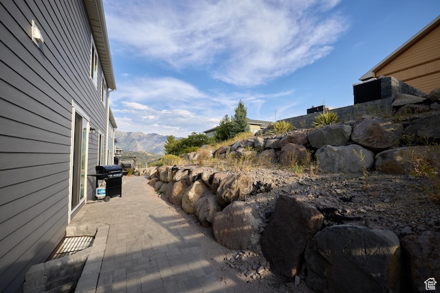 exterior space featuring a patio and a mountain view