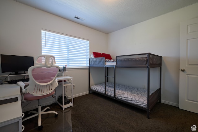 carpeted bedroom with baseboards and visible vents