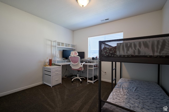 bedroom featuring dark carpet, visible vents, and baseboards