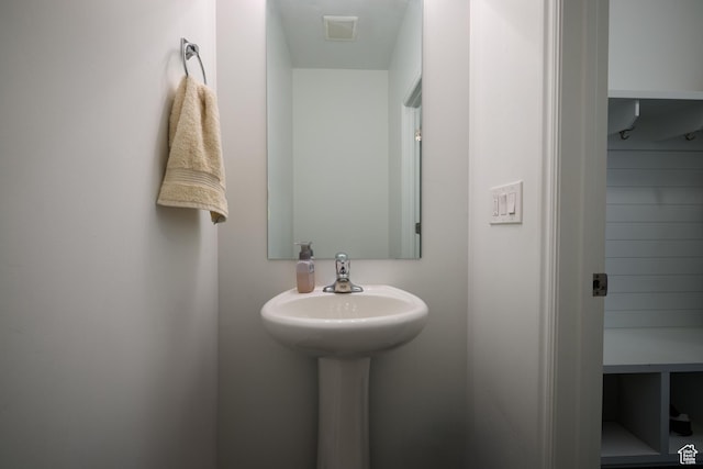bathroom featuring a sink and visible vents