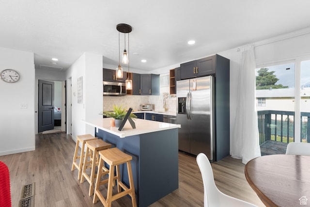 8235 S 1640 W, West Jordan, UT 84088 - kitchen with tasteful backsplash, visible vents, open shelves, light countertops, and stainless steel appliances