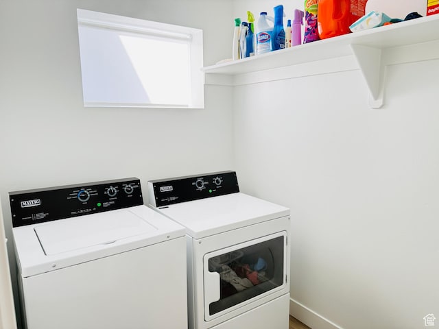 laundry area featuring independent washer and dryer and laundry area