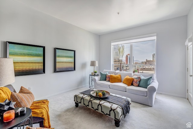 living room featuring baseboards and carpet