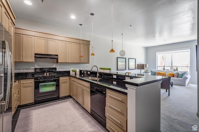 kitchen with a peninsula, dark countertops, black appliances, under cabinet range hood, and a sink